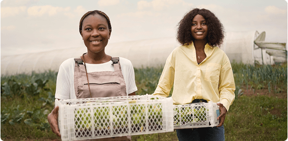 Farmers with produce boxes